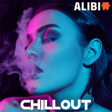 Woman blowing out smoke