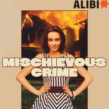 Woman standing in front of a house on fire