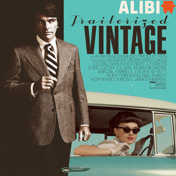 Woman in classic car and man standing in a suit