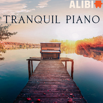 A piano at the end of a dock on water