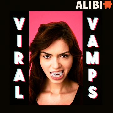Woman wearing vampire teeth