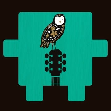 Decorative owl perched on a guitar headstock