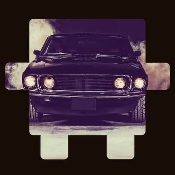 Front view of a vintage car with headlights