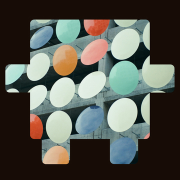 Colorful circles on the side of a parking garage