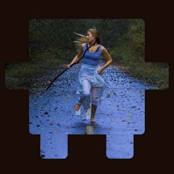 Person running down a wet road holding an umbrella