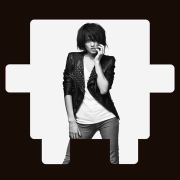 Black-and-white photo of a person in a leather jacket posing