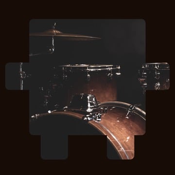 Close-up of a drum set in low light